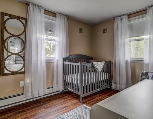 29 Lindsay Road Billerica, MA 01821 - Photo 16 of 28 a view of a bedroom with wooden floor and windows