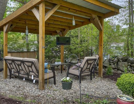 29 Lindsay Road Billerica, MA 01821 - Photo 24 of 28 a view of backyard with table and chairs and potted plants