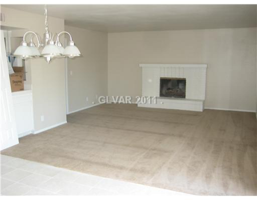 6590 Turina Road Las Vegas, NV 89146 - Photo 3 of 13 Den. Family room w fireplace!