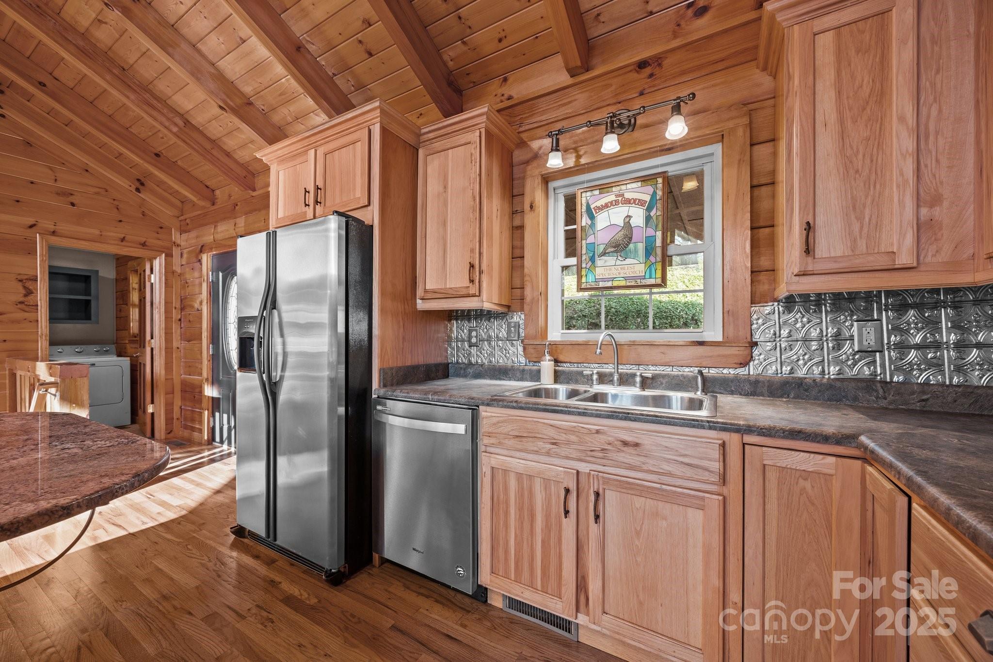 4710 Highway 441 Sylva, NC 28779 - Photo 19 of 40 a kitchen with stainless steel appliances granite countertop a refrigerator and a sink