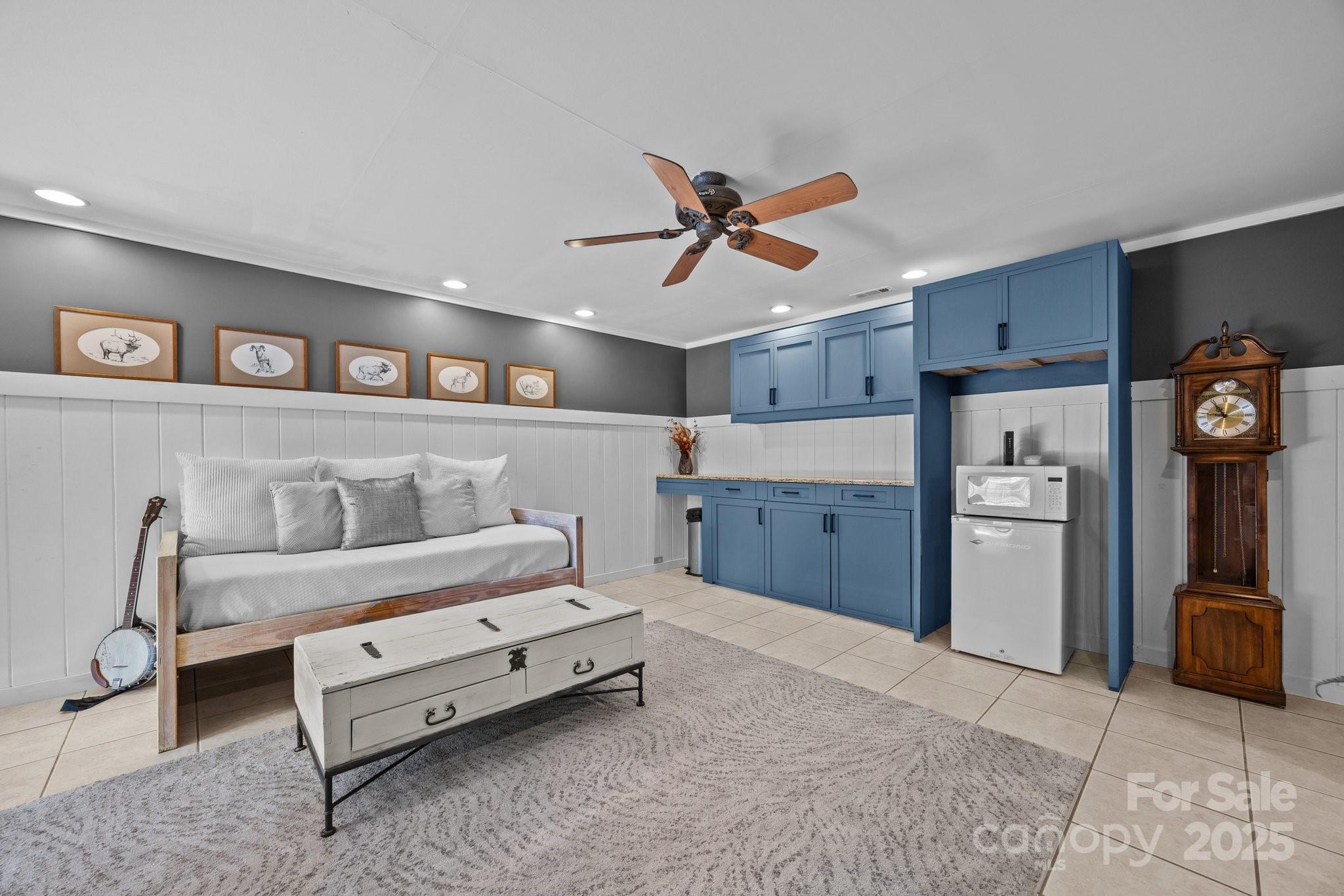 4710 Highway 441 Sylva, NC 28779 - Photo 33 of 40 a bedroom with a bed and a chandelier