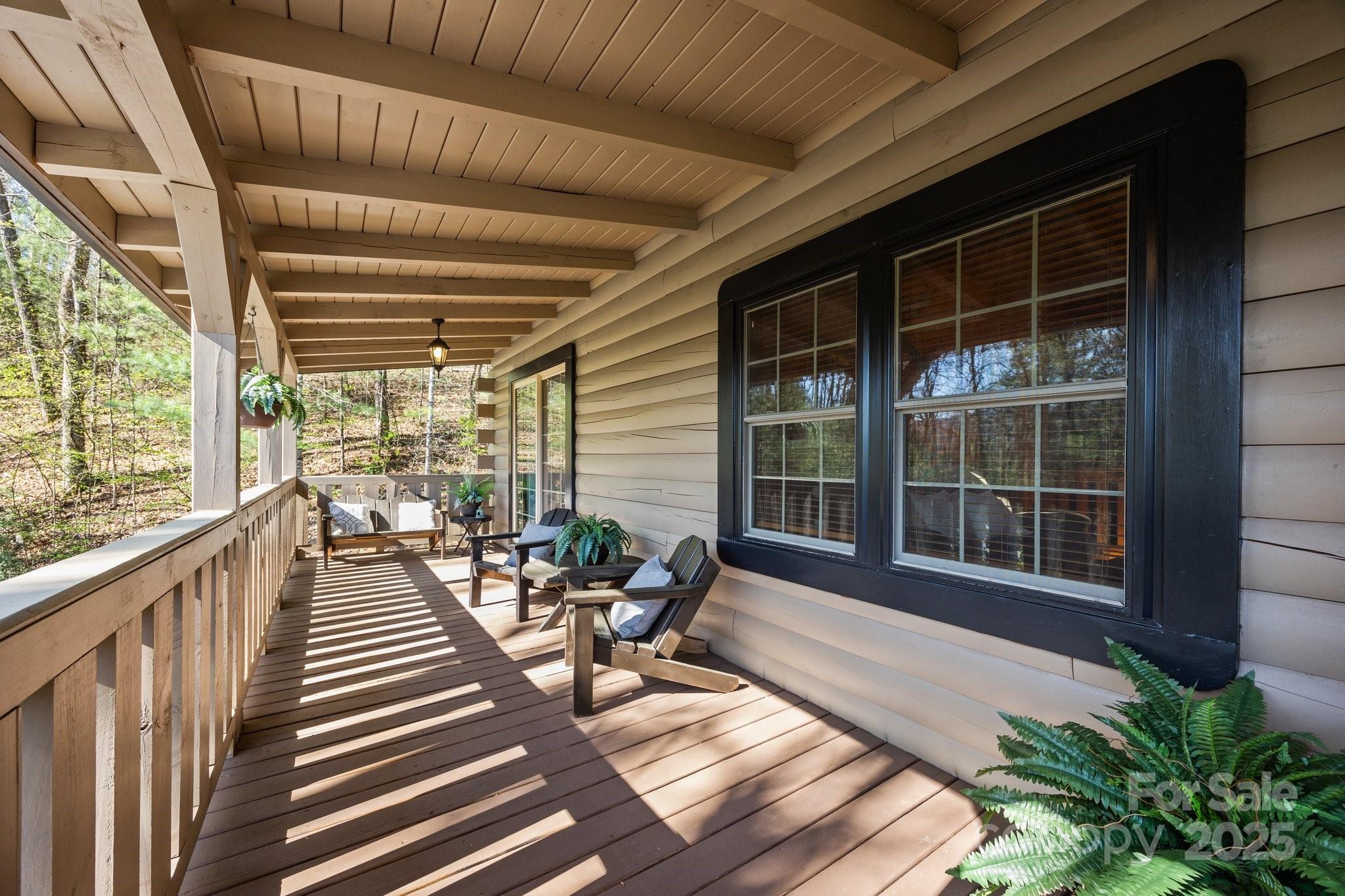 4710 Highway 441 Sylva, NC 28779 - Photo 5 of 40 a balcony with chairs and wooden floor