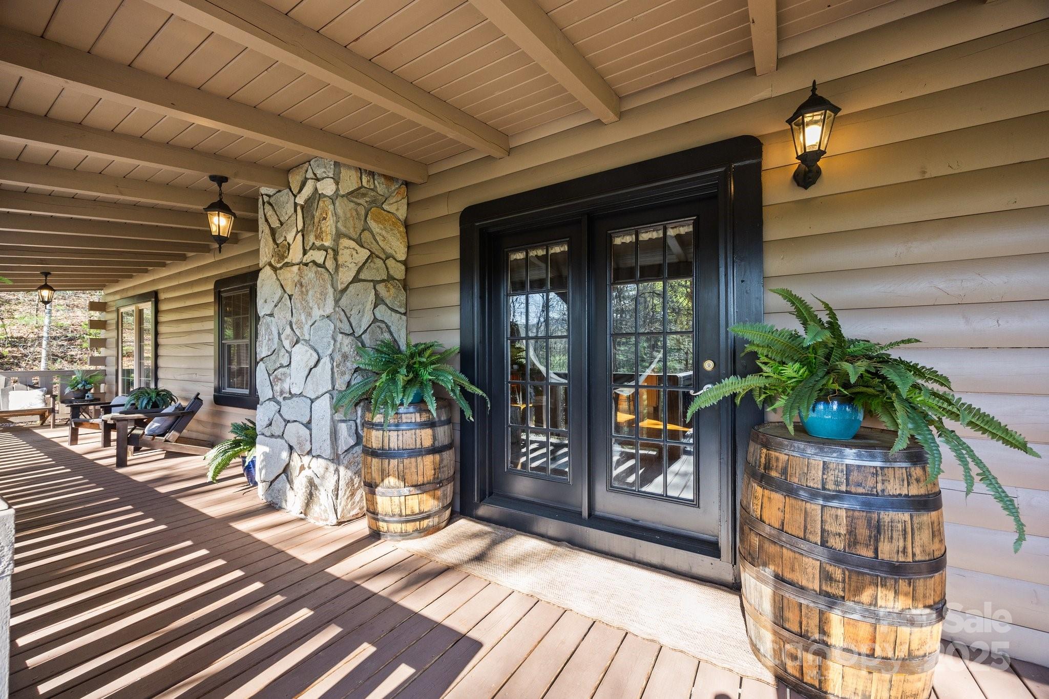4710 Highway 441 Sylva, NC 28779 - Photo 6 of 40 a view of a porch with chairs and potted plants