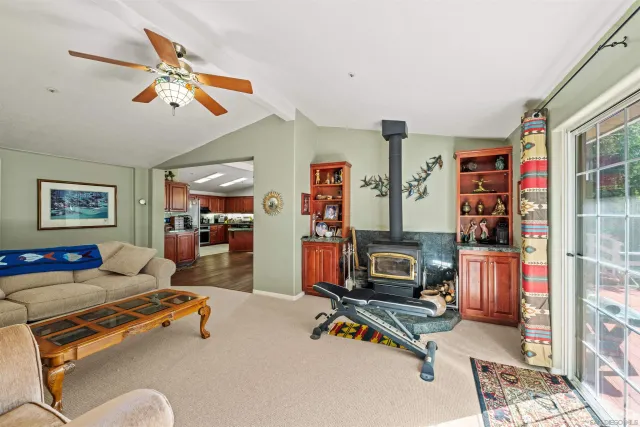 a bedroom with furniture and a flat screen tv
