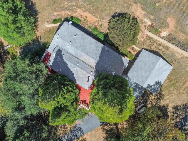 an aerial view of house with yard