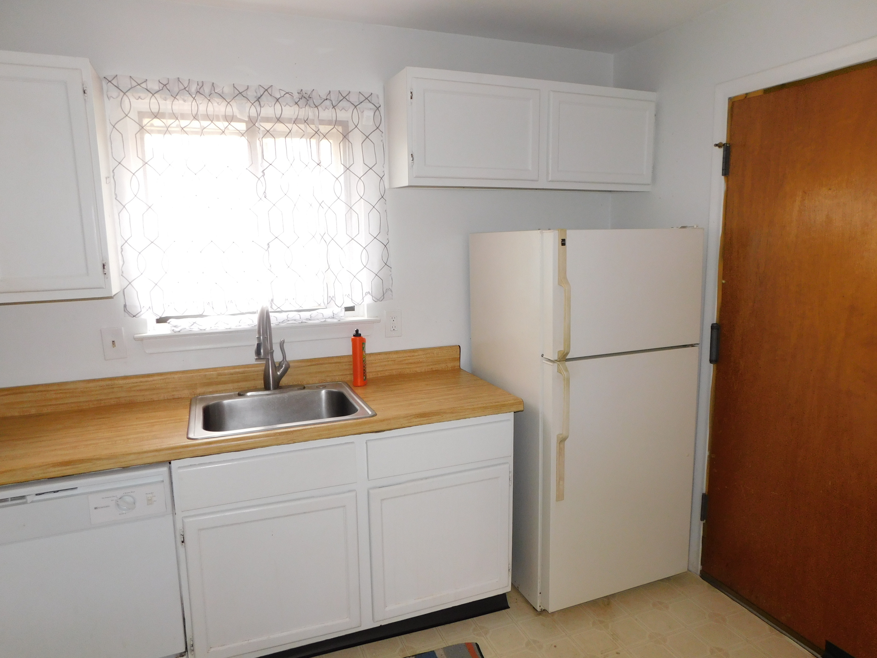98 High Path Road, Unit 98 Windsor, CT 06095 - Photo 3 of 13 a kitchen with a refrigerator and a sink