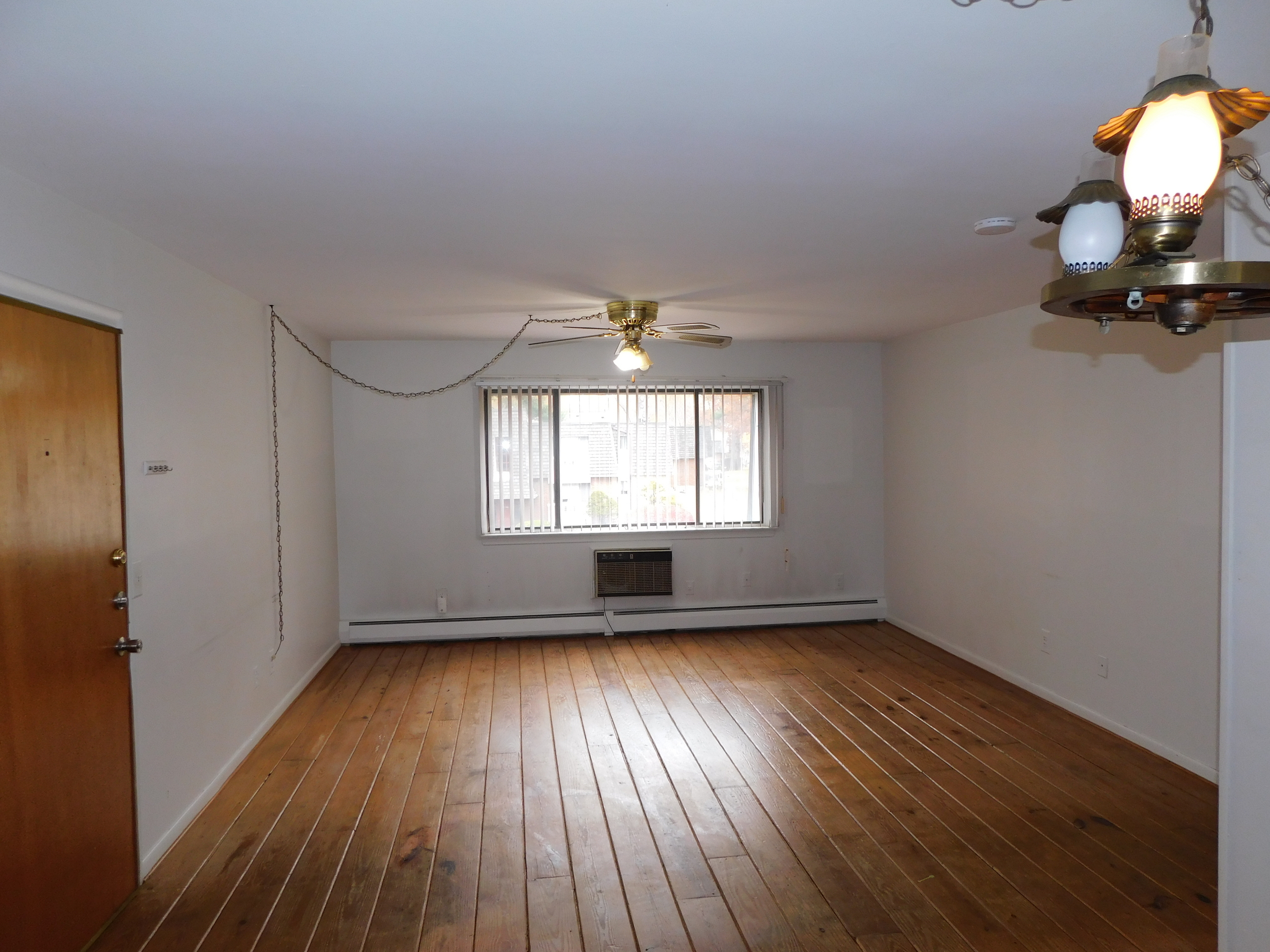 98 High Path Road, Unit 98 Windsor, CT 06095 - Photo 5 of 13 wooden floor in an empty room with a window