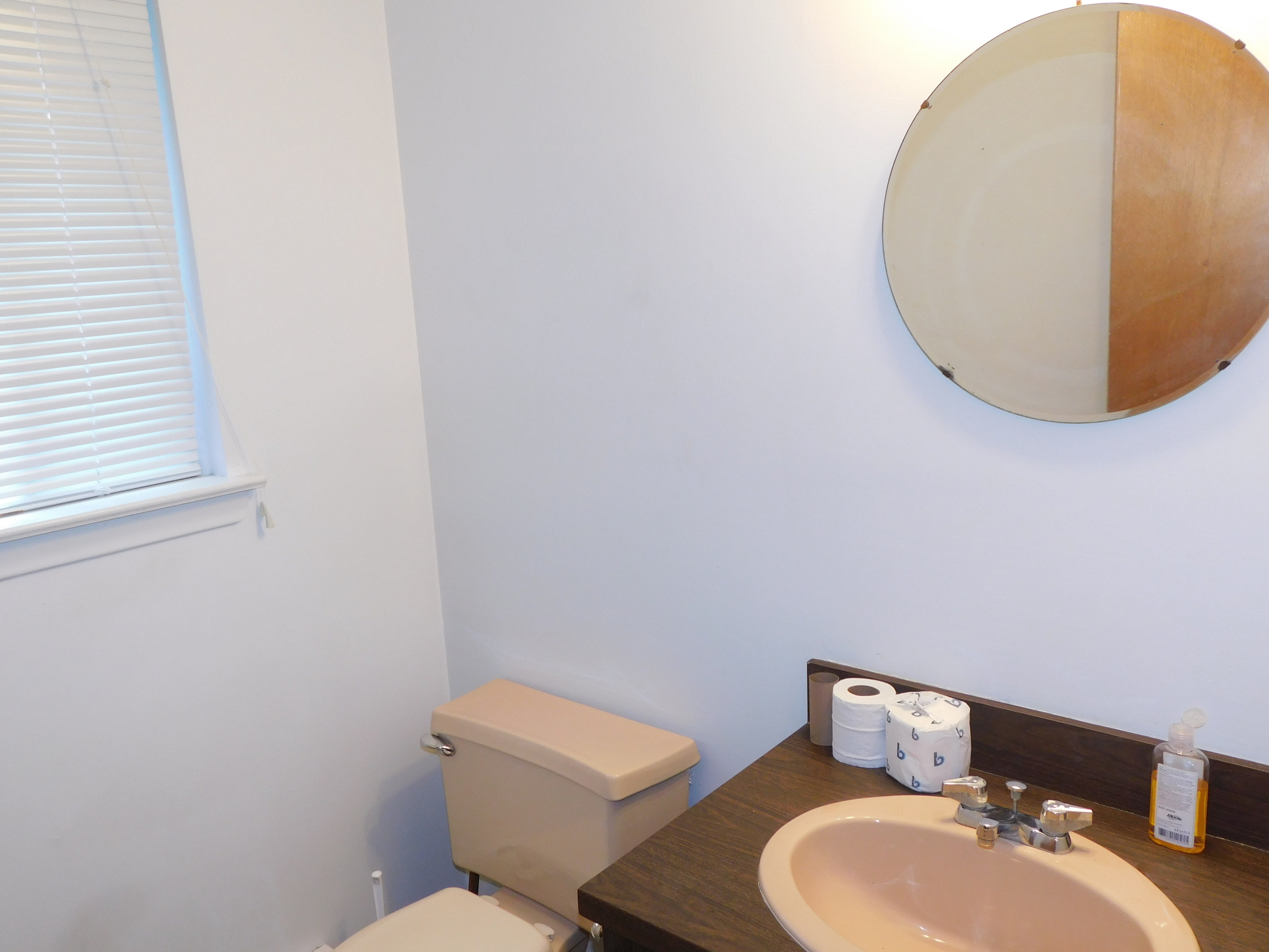 98 High Path Road, Unit 98 Windsor, CT 06095 - Photo 7 of 13 a bathroom with a toilet and a mirror