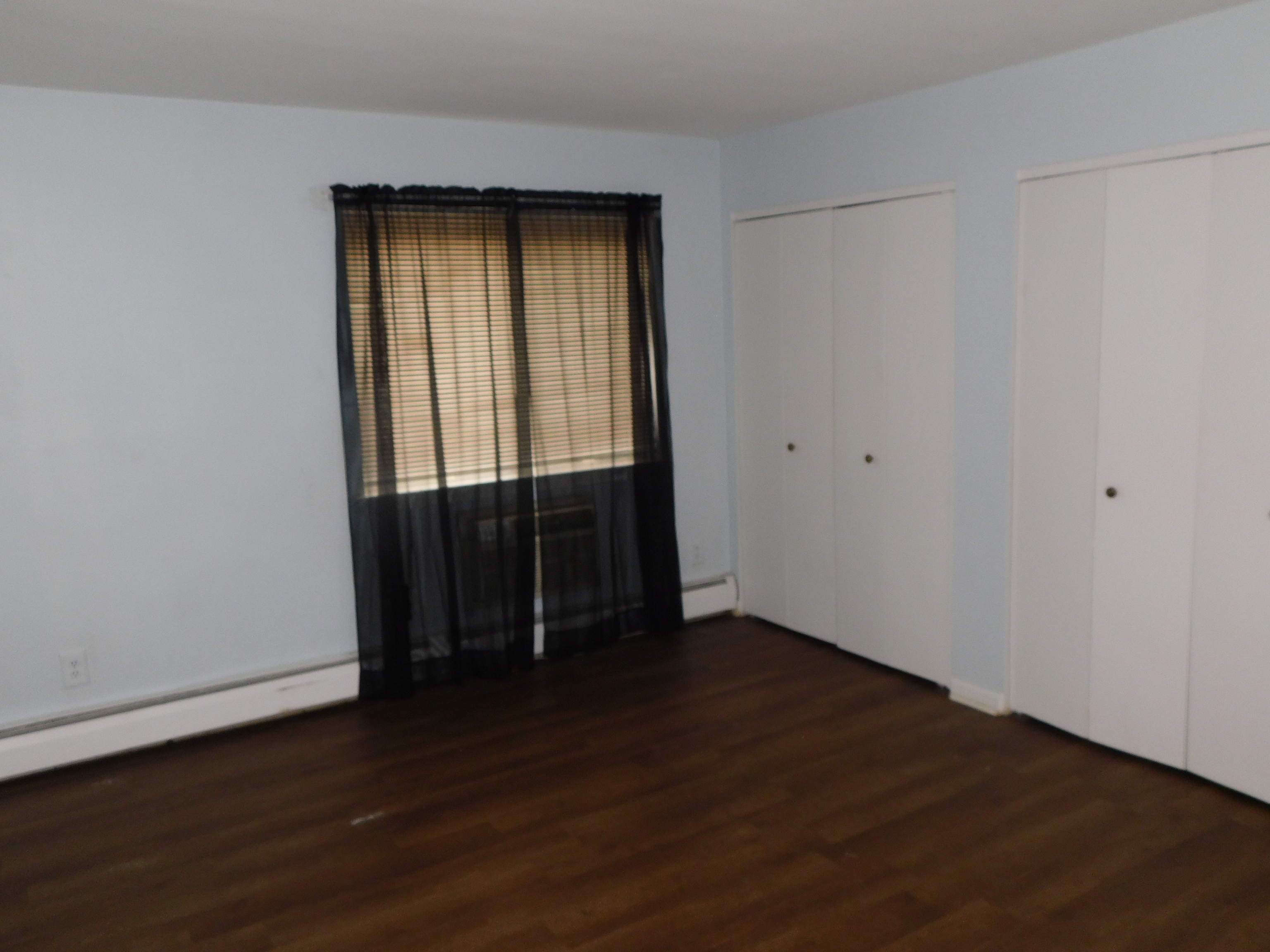 98 High Path Road, Unit 98 Windsor, CT 06095 - Photo 8 of 13 an empty room with wooden floor and closet