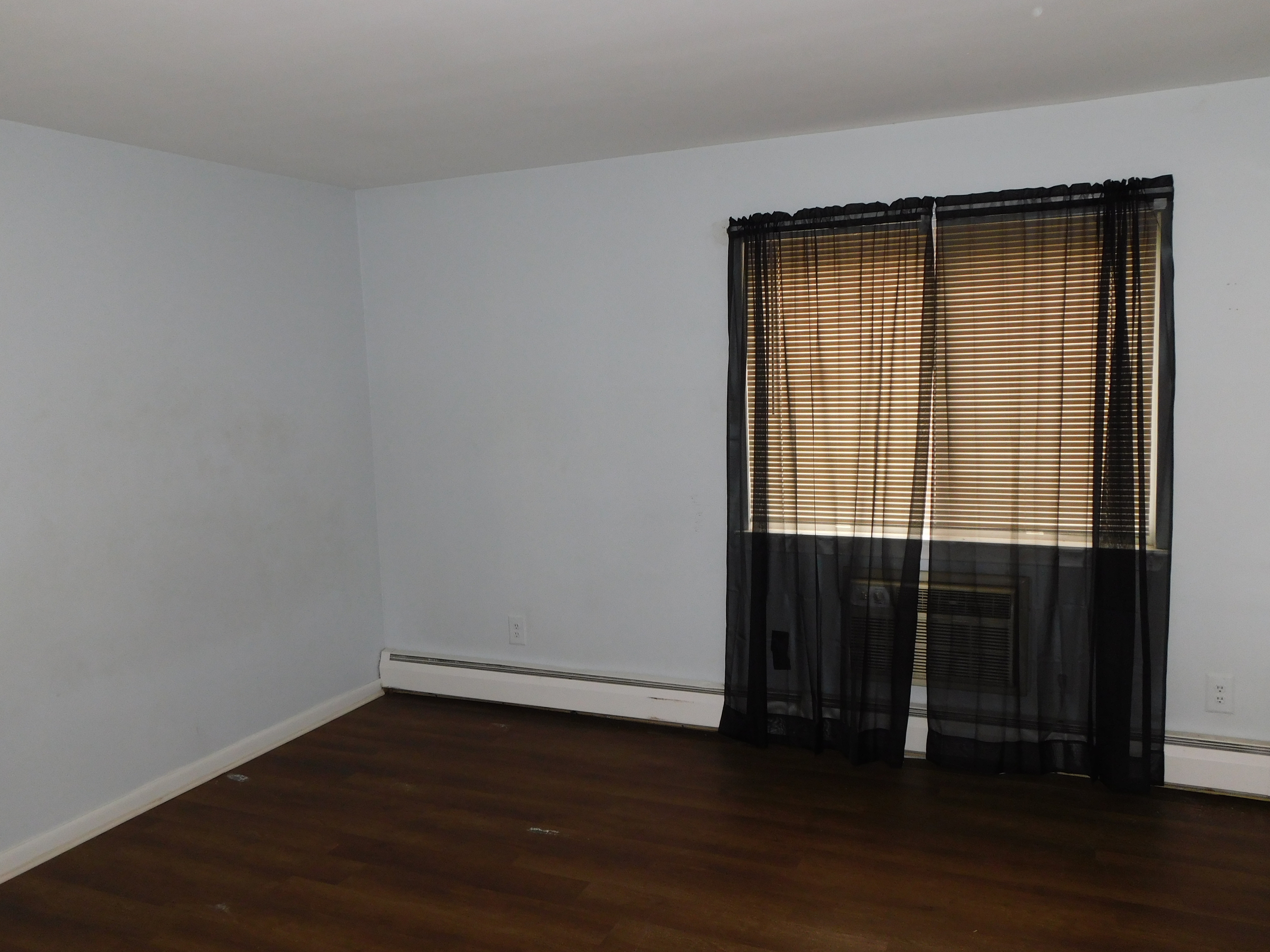 98 High Path Road, Unit 98 Windsor, CT 06095 - Photo 9 of 13 an empty room with wooden floor and a window