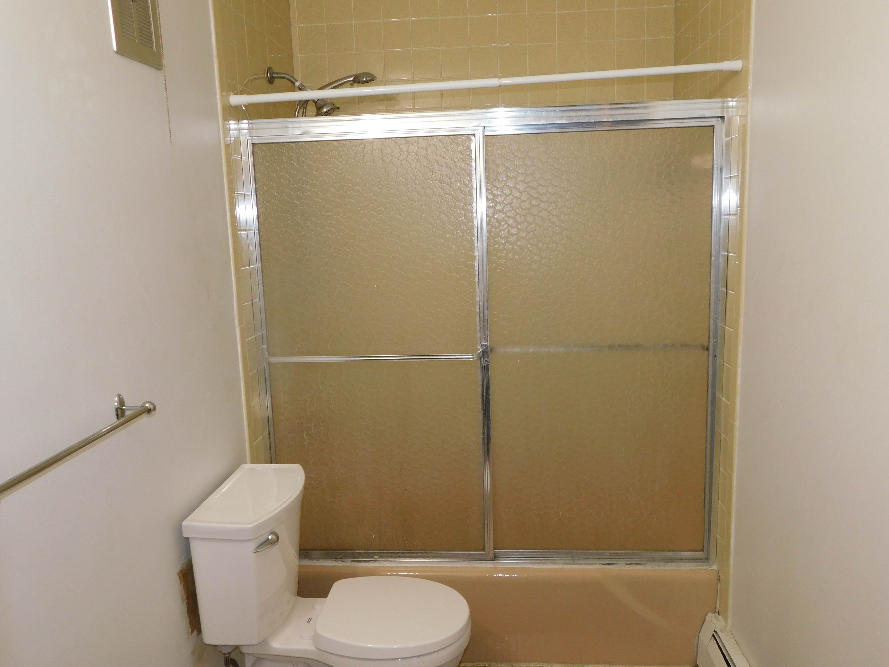 98 High Path Road, Unit 98 Windsor, CT 06095 - Photo 10 of 13 a bathroom with a shower a toilet and a sink