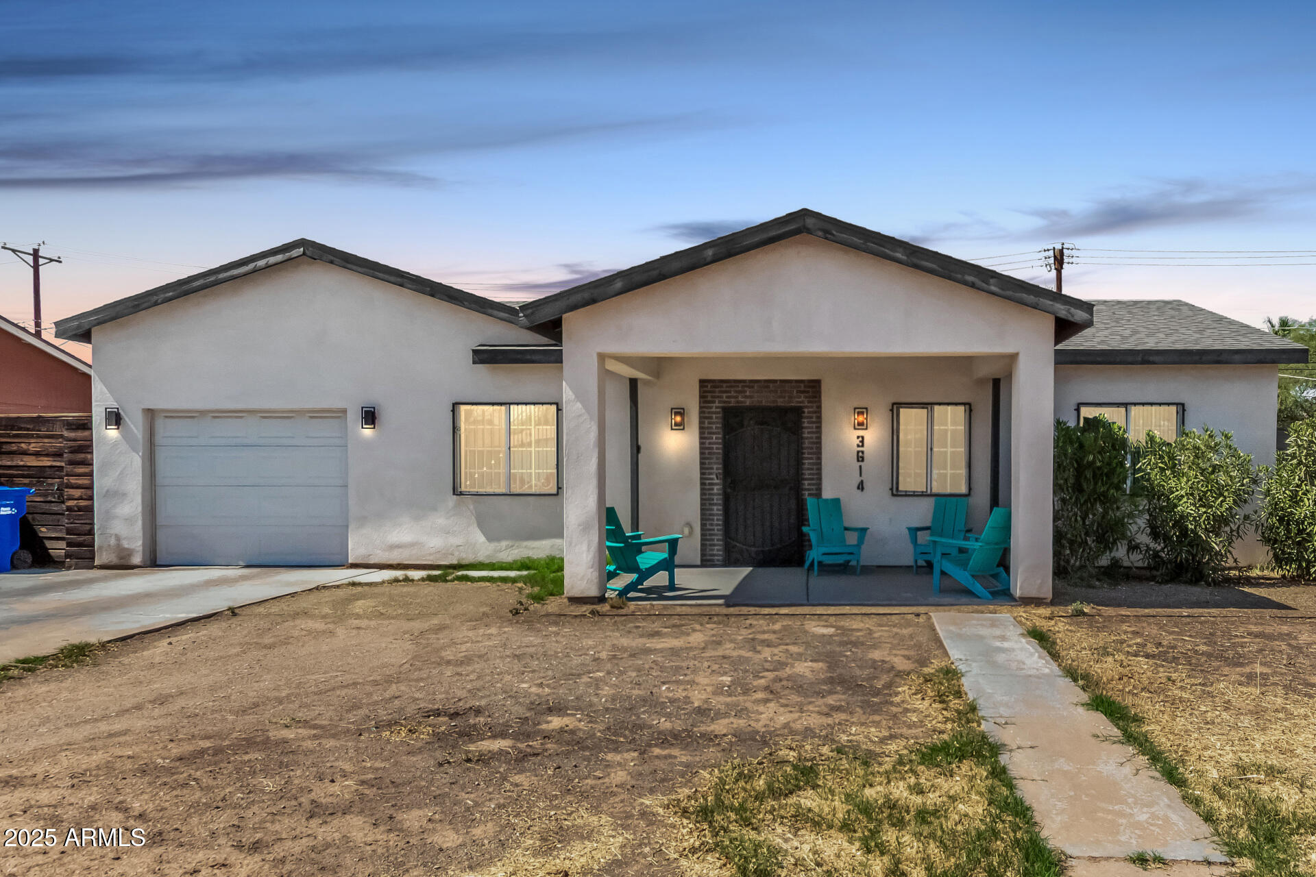 a view of a house with backyard and parking space