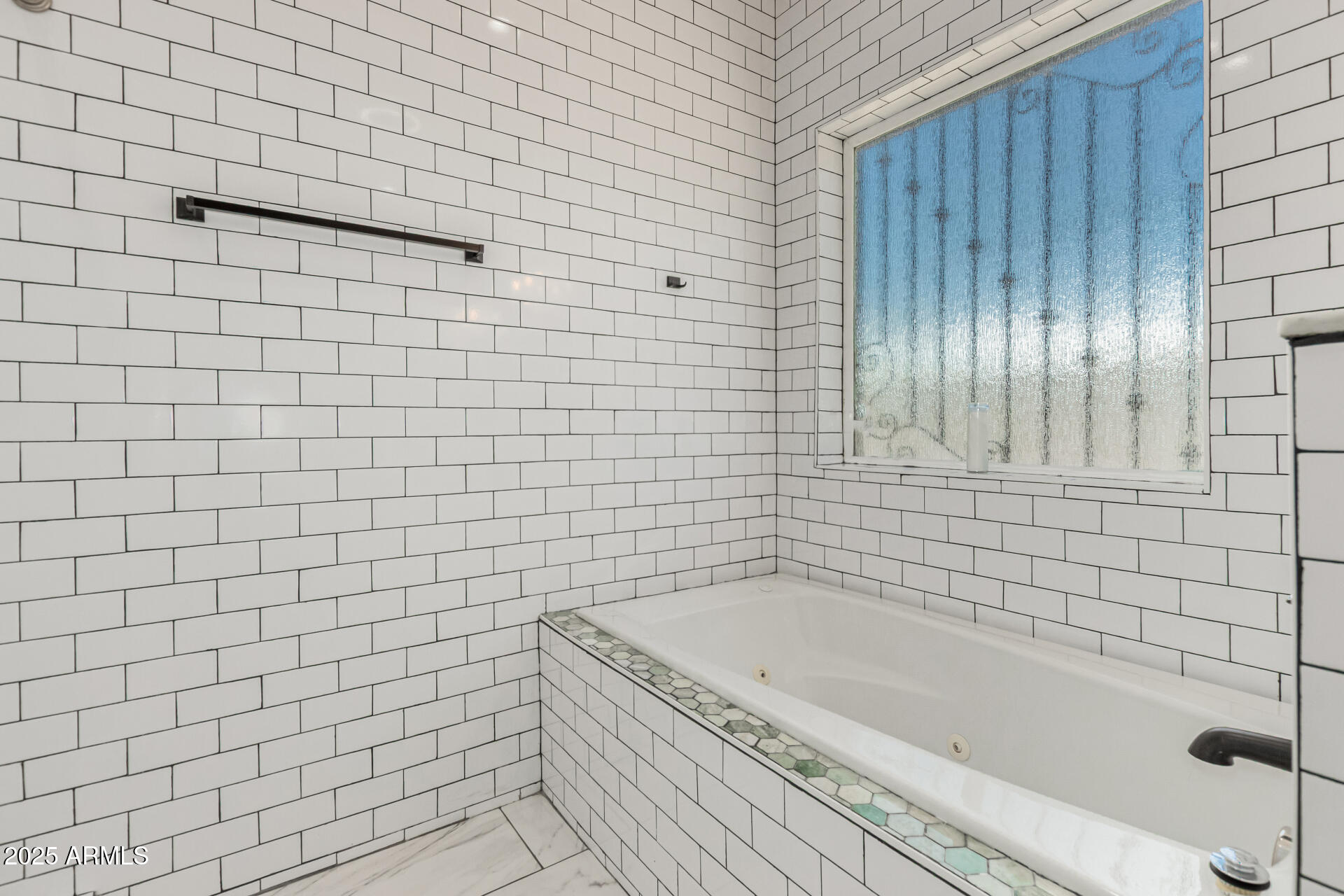 3614 West Granada Road Phoenix, AZ 85009 - Photo 18 of 30 a bathroom with a bathtub and shower