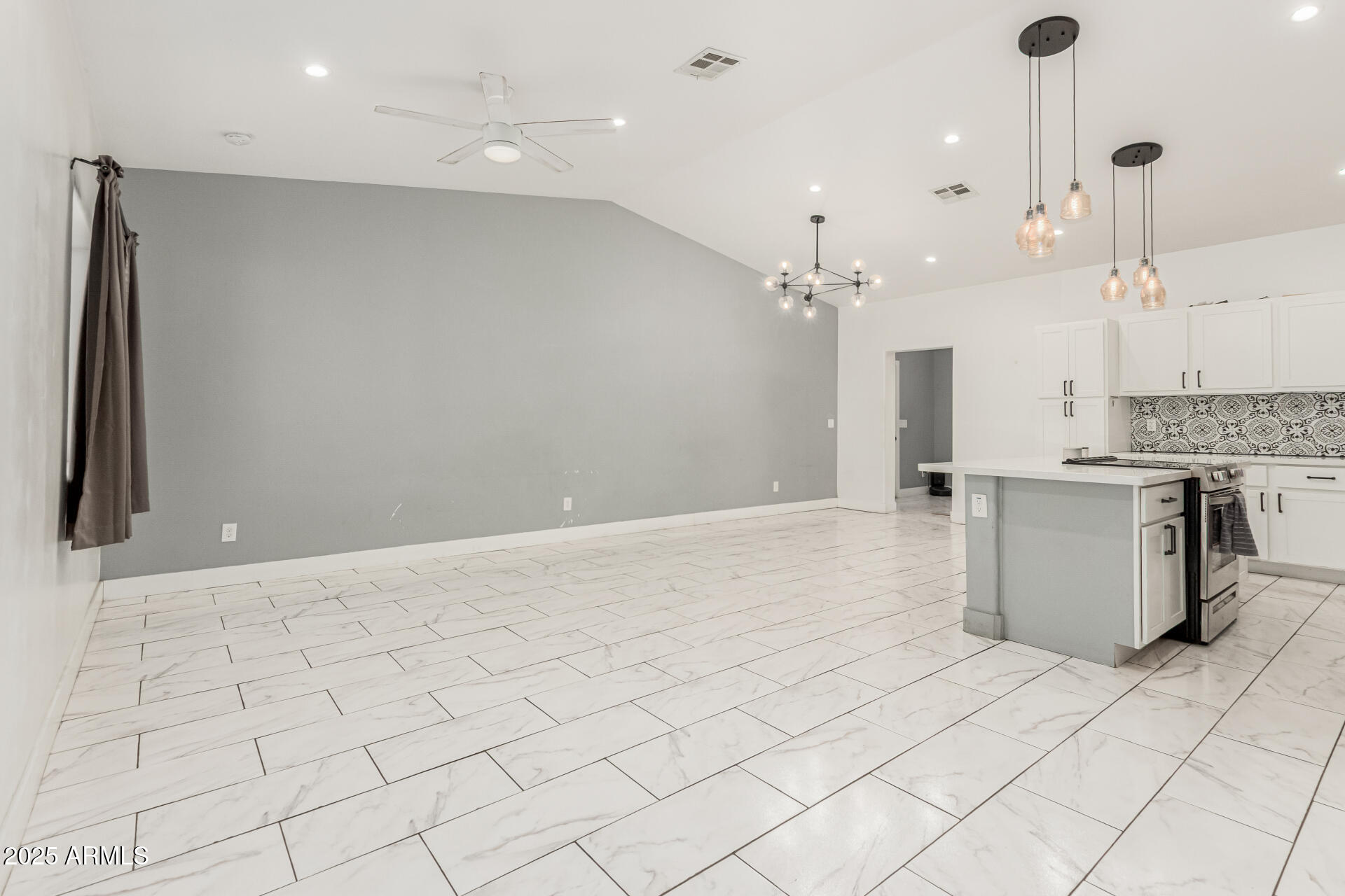 3614 West Granada Road Phoenix, AZ 85009 - Photo 23 of 30 a large white kitchen with a large window