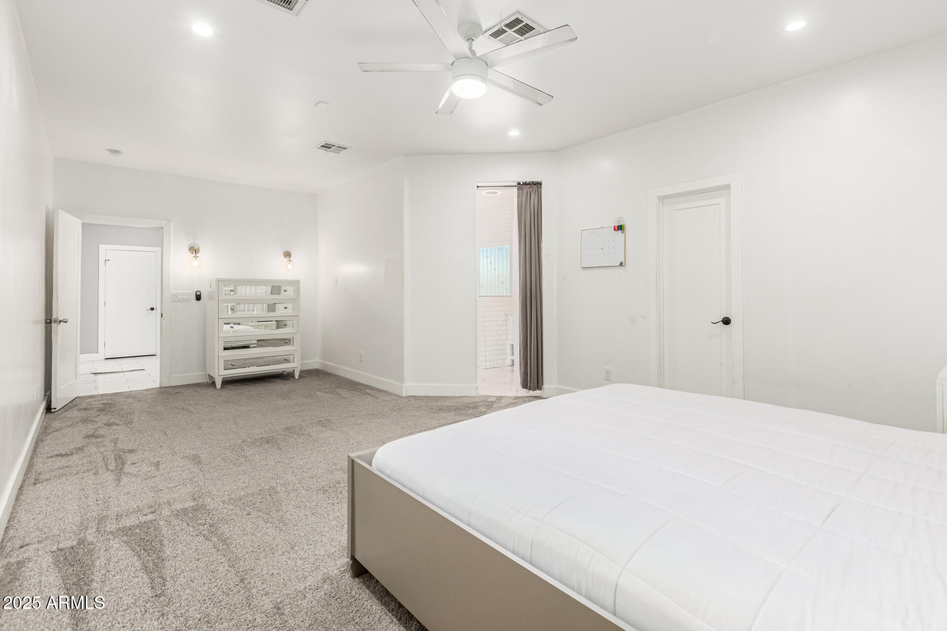 3614 West Granada Road Phoenix, AZ 85009 - Photo 7 of 30 a room with a bed and cabinets