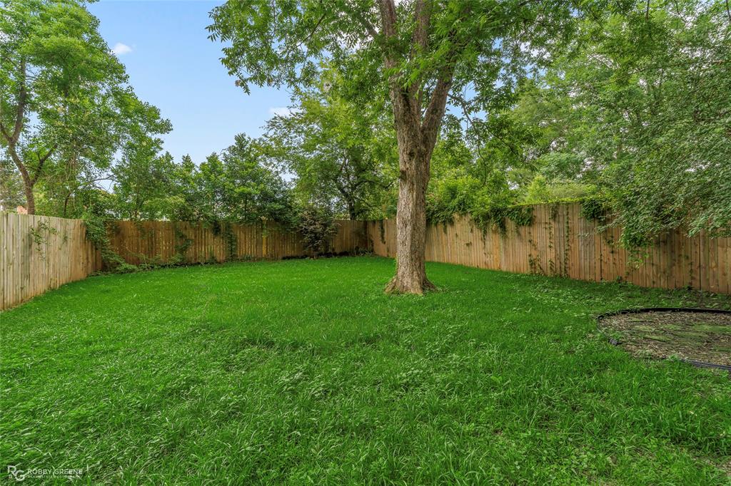 515 Davis Street Minden, LA 71055 - Photo 26 of 28 a view of a yard with a tree