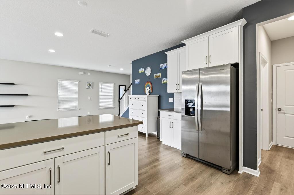 542 Silver Landing Drive St. Augustine, FL 32092 - Photo 21 of 55 a kitchen with stainless steel appliances a refrigerator sink and microwave