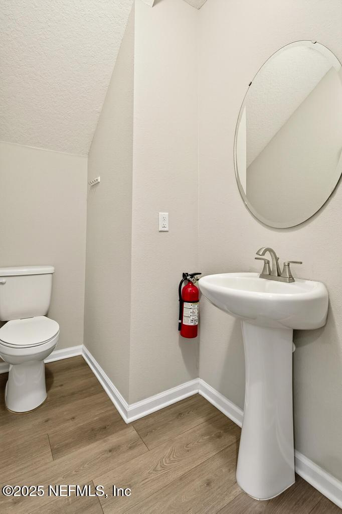 542 Silver Landing Drive St. Augustine, FL 32092 - Photo 23 of 55 a bathroom with a sink toilet and a mirror