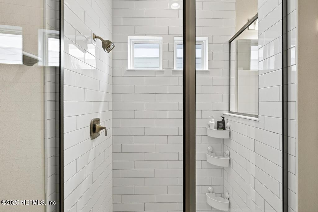 542 Silver Landing Drive St. Augustine, FL 32092 - Photo 33 of 55 a bathroom with a glass door shower