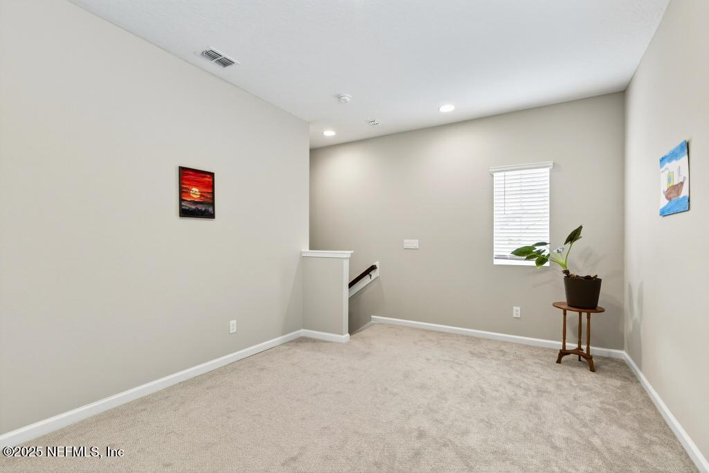 542 Silver Landing Drive St. Augustine, FL 32092 - Photo 39 of 55 a view of a livingroom with a potted plant