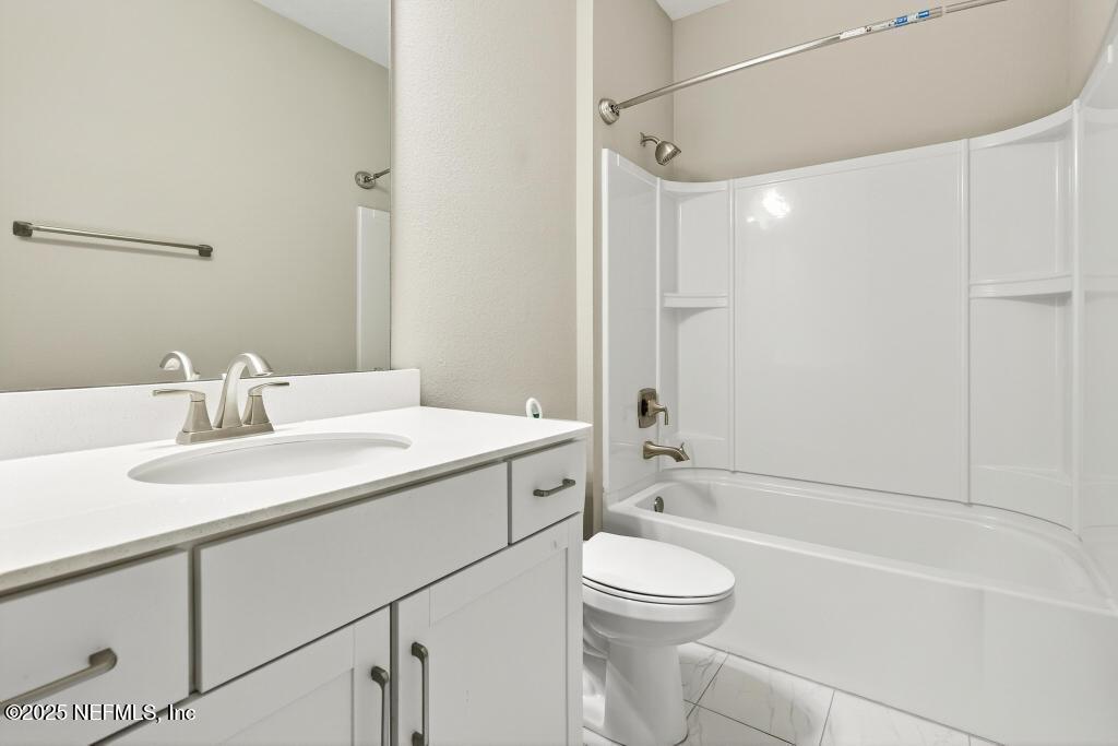 542 Silver Landing Drive St. Augustine, FL 32092 - Photo 43 of 55 a bathroom with a sink a toilet and shower