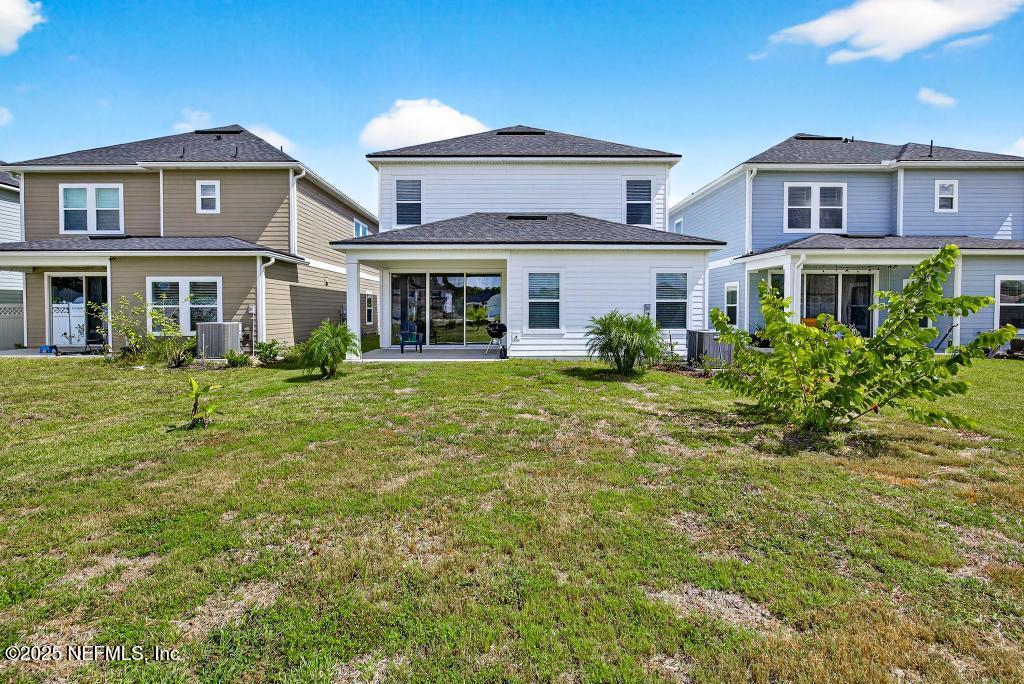 542 Silver Landing Drive St. Augustine, FL 32092 - Photo 51 of 55 a front view of a house with a yard