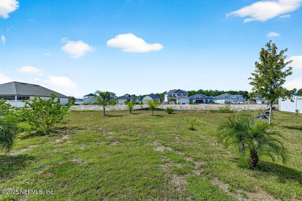 542 Silver Landing Drive St. Augustine, FL 32092 - Photo 52 of 55 a view of a lake with a big yard