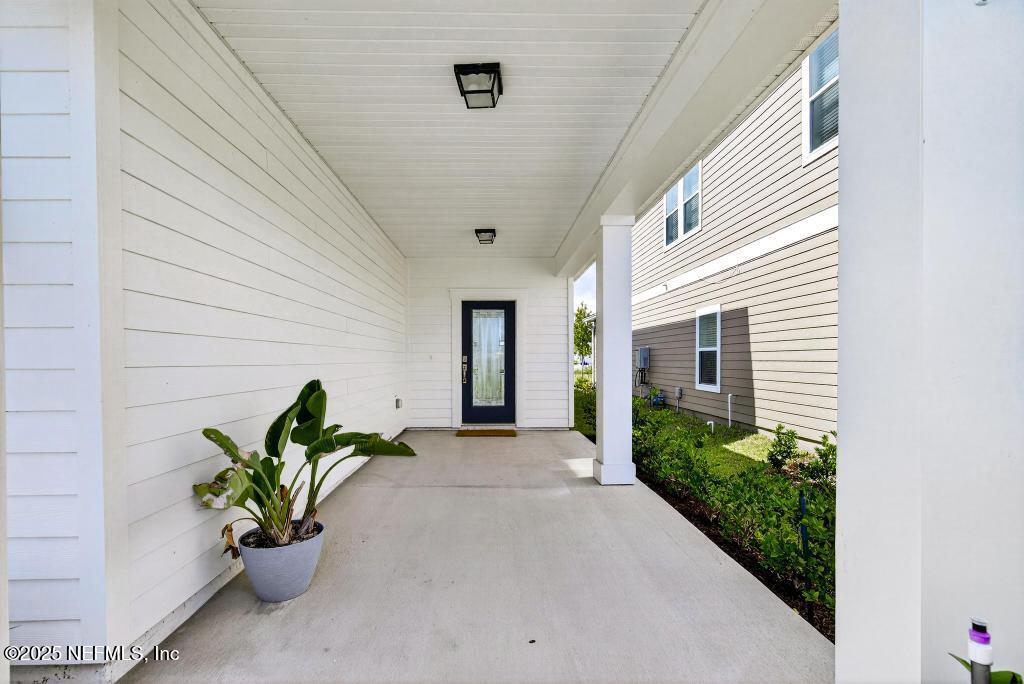 542 Silver Landing Drive St. Augustine, FL 32092 - Photo 7 of 55 a front view of a house with a garden