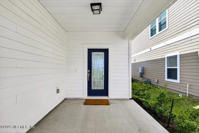 a view of an entryway door front of house