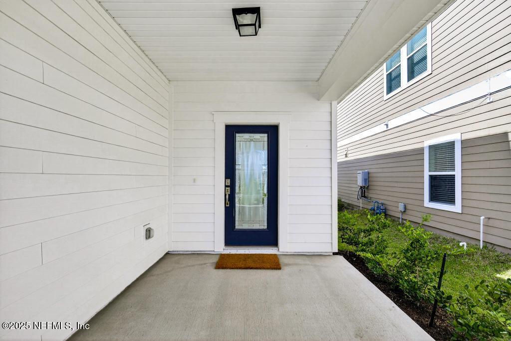 542 Silver Landing Drive St. Augustine, FL 32092 - Photo 8 of 55 a view of an entryway door front of house