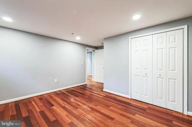 a view of room with wooden floor