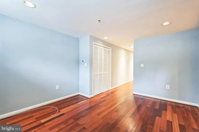 a view of room with wooden floor