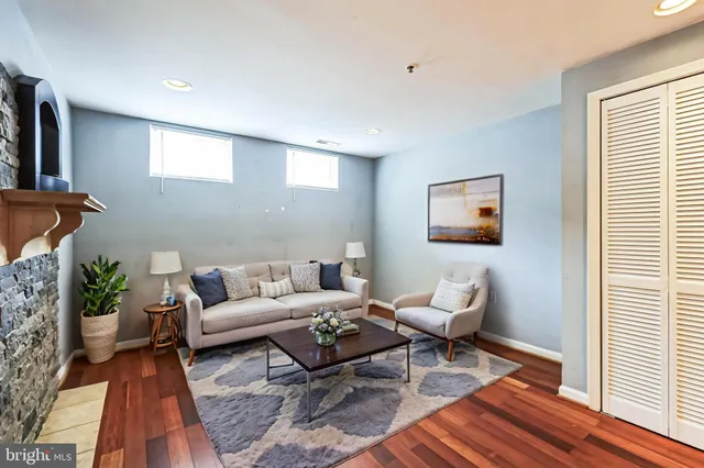 a living room with furniture and a rug