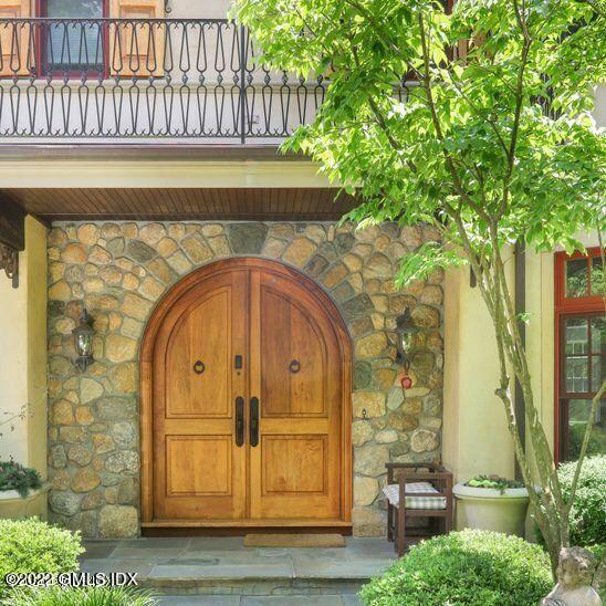 211 Orchard Street Cos Cob, CT 06830 - Photo 1 of 40 a front view of a house with parking
