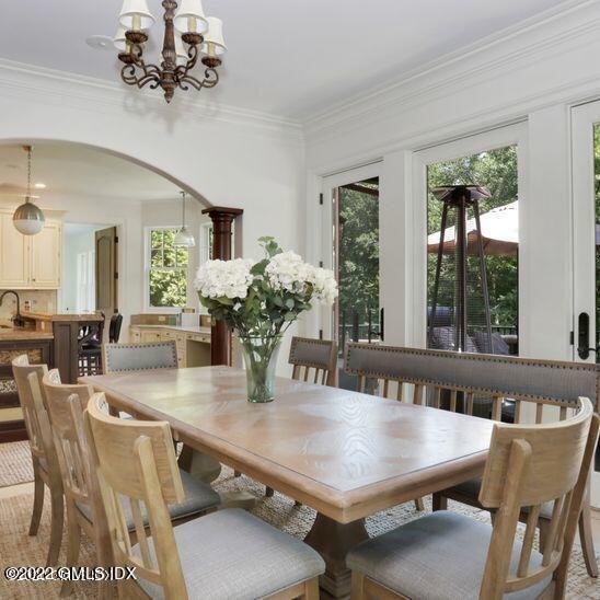 211 Orchard Street Cos Cob, CT 06830 - Photo 16 of 40 a view of a dining room with furniture window and wooden floor