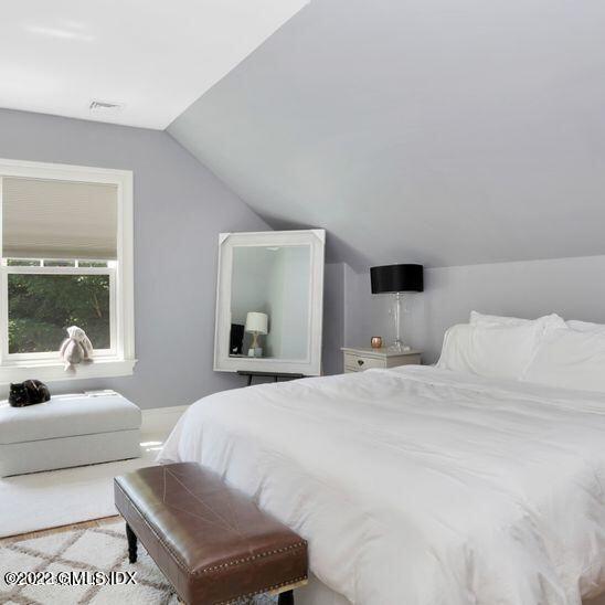 211 Orchard Street Cos Cob, CT 06830 - Photo 23 of 40 a bedroom with a bed and a couch
