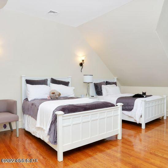 211 Orchard Street Cos Cob, CT 06830 - Photo 24 of 40 a bedroom with two beds and a couch
