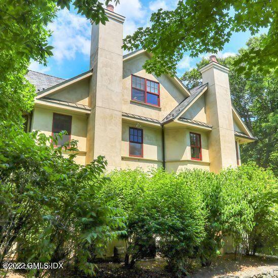 211 Orchard Street Cos Cob, CT 06830 - Photo 4 of 40 a front view of a house with trees