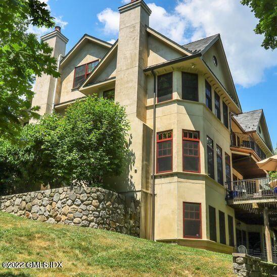 211 Orchard Street Cos Cob, CT 06830 - Photo 5 of 40 a front view of a house with a yard