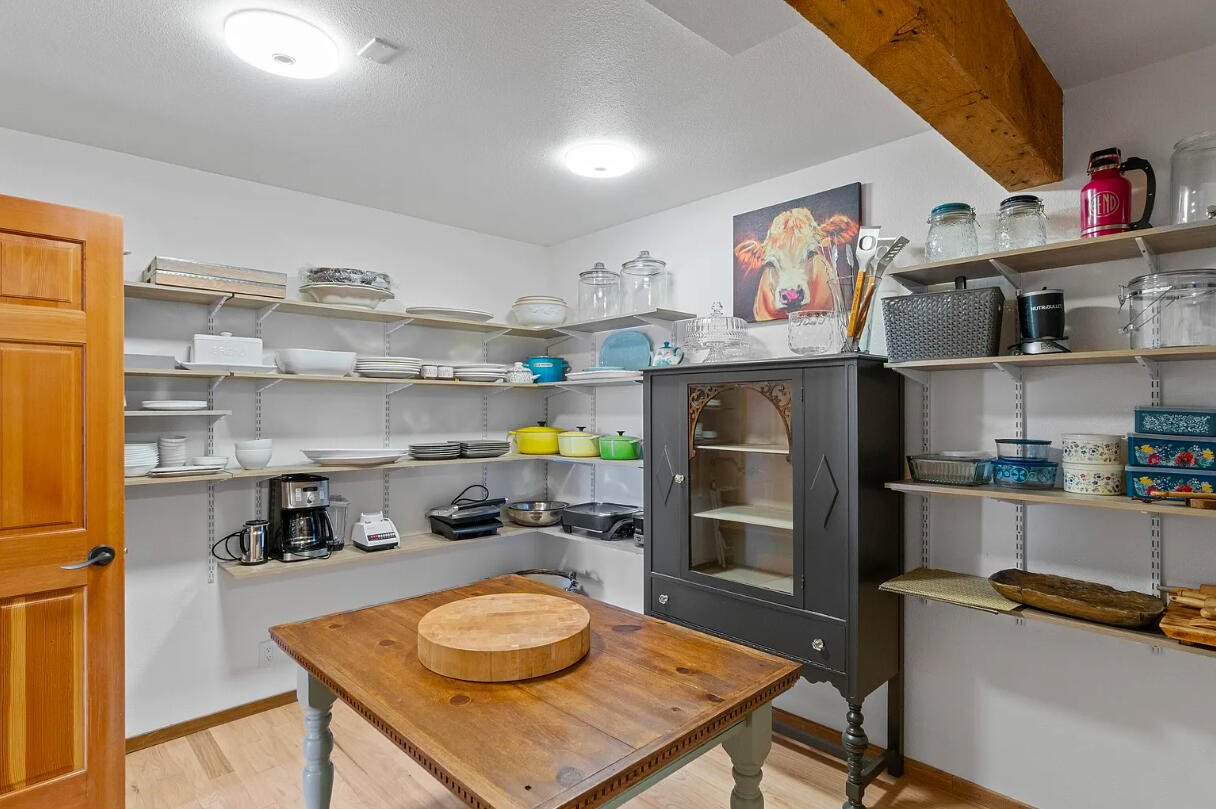 60359 Arnold Market Road Bend, OR 97702 - Photo 22 of 64 walk-in pantry with open shelving storage and (2) additional closet pantries with shelving