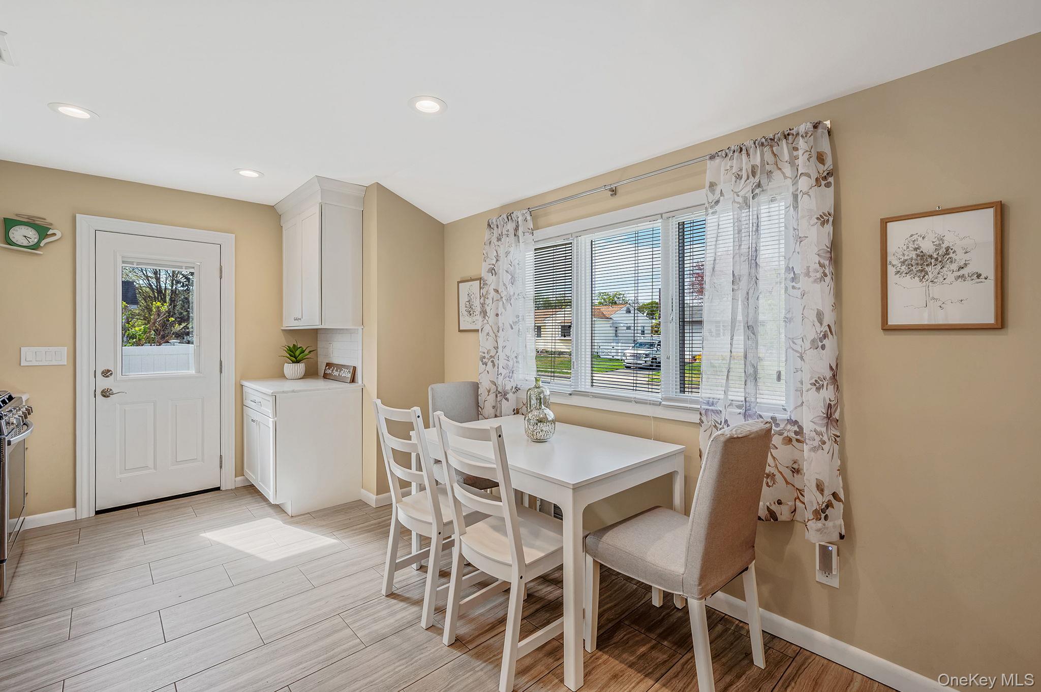 46 Sheldon Place Commack, NY 11725 - Photo 11 of 32 a view of a dining room with furniture and wooden floor