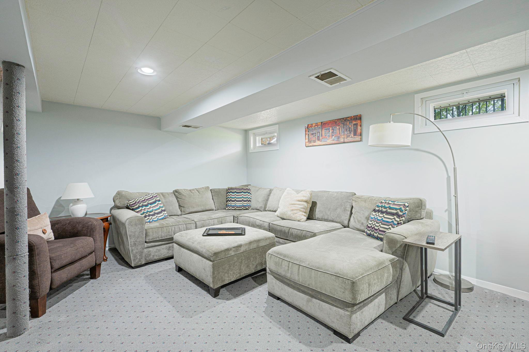 46 Sheldon Place Commack, NY 11725 - Photo 18 of 32 a living room with furniture and a couch