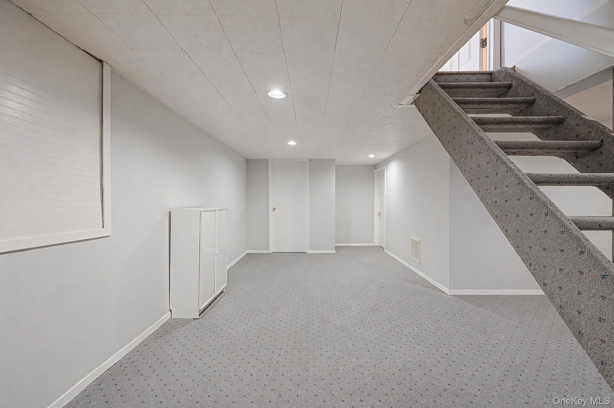 46 Sheldon Place Commack, NY 11725 - Photo 20 of 32 a view of an empty room with stairs