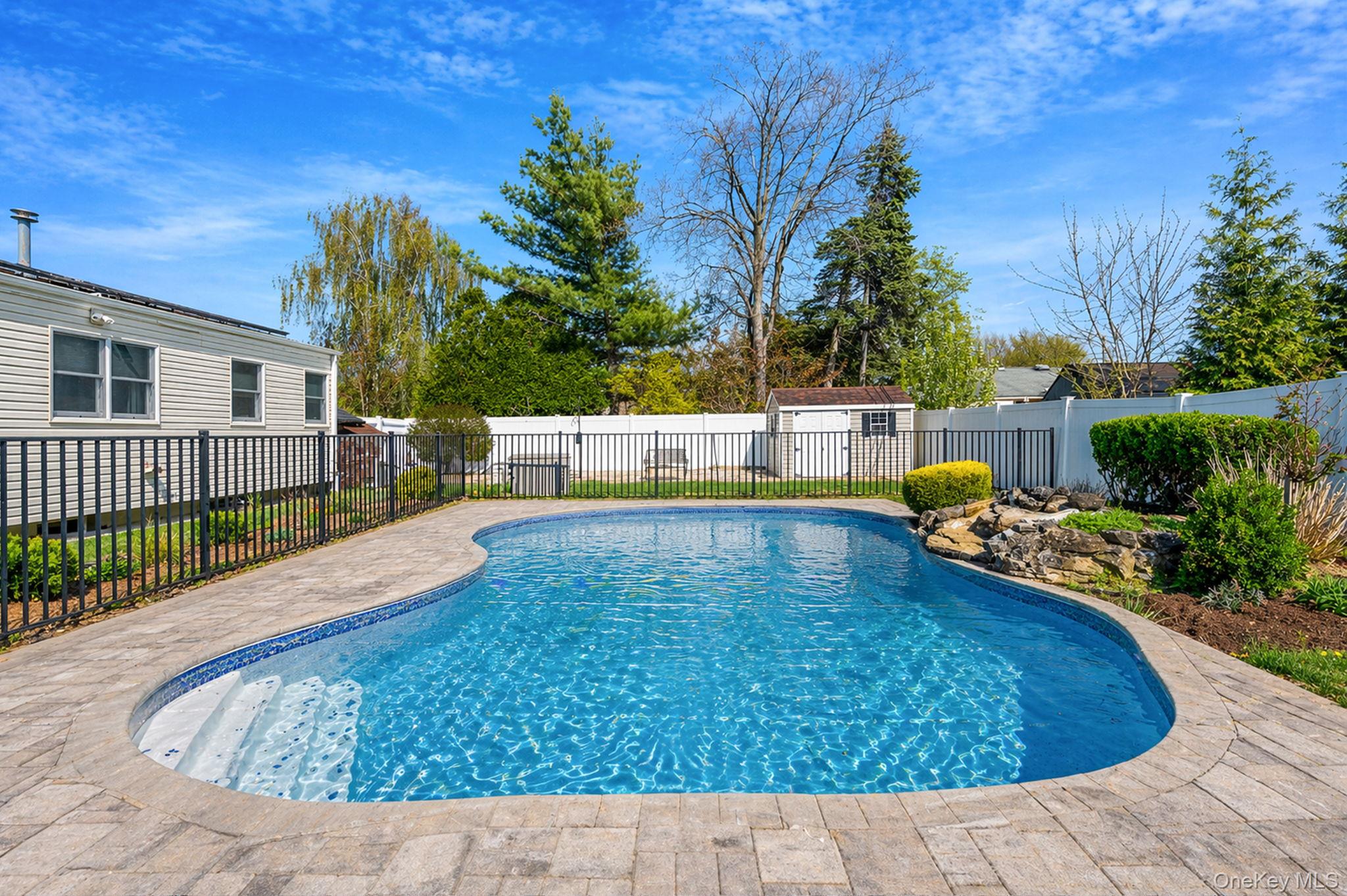 46 Sheldon Place Commack, NY 11725 - Photo 25 of 32 a view of swimming pool with a patio