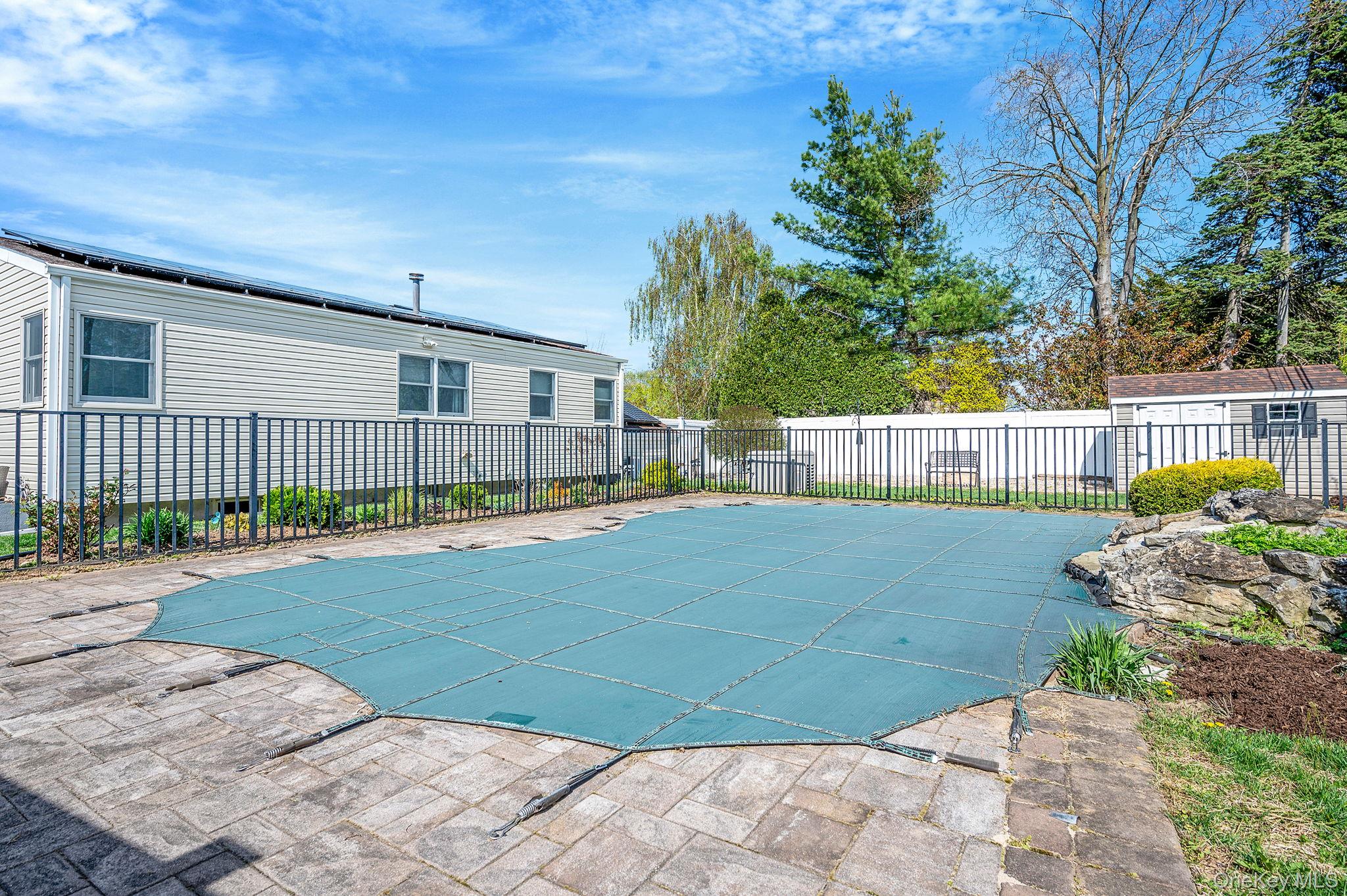 46 Sheldon Place Commack, NY 11725 - Photo 26 of 32 a view of a backyard with a garden