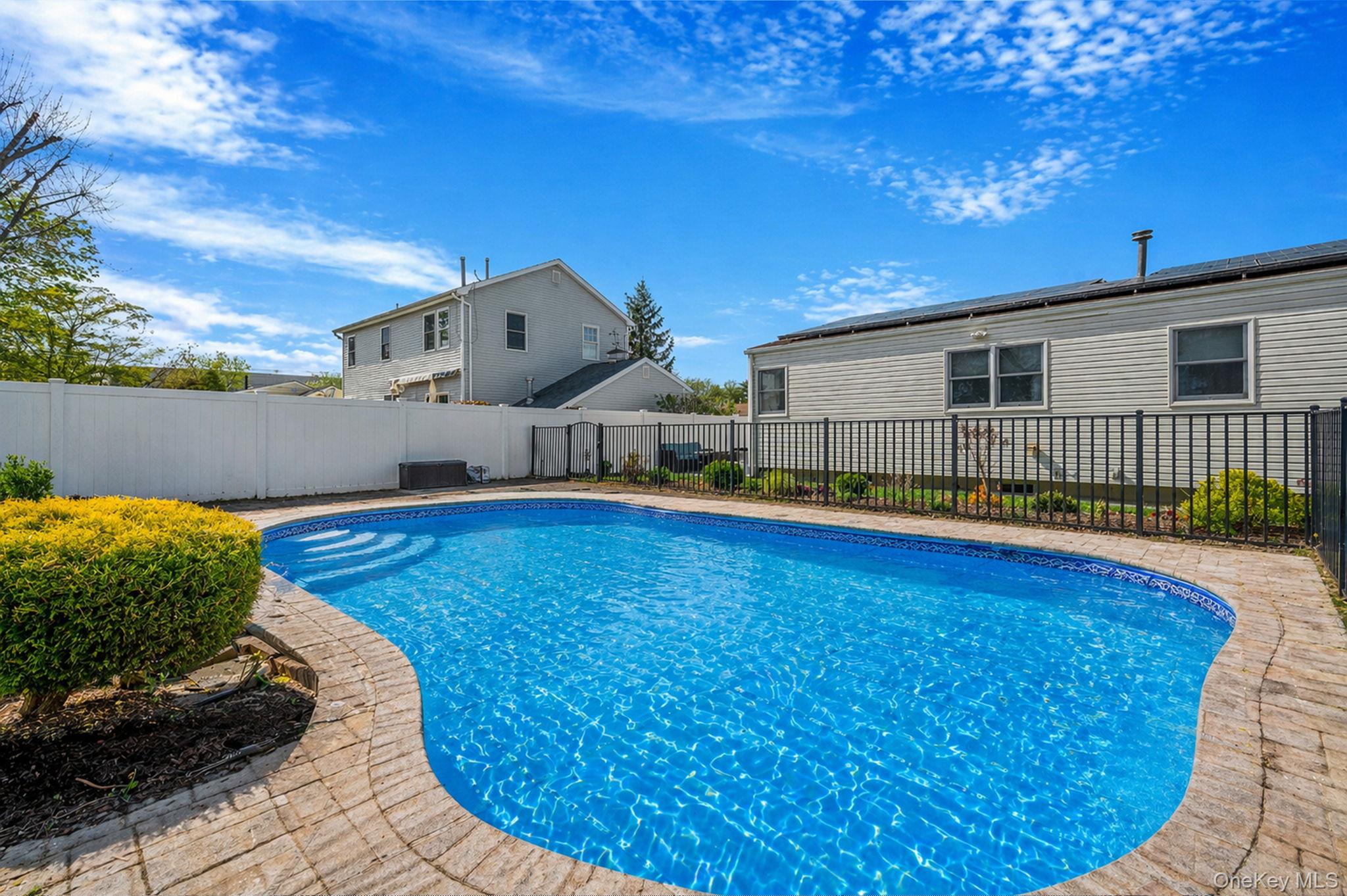 46 Sheldon Place Commack, NY 11725 - Photo 28 of 32 a view of a backyard with swimming pool