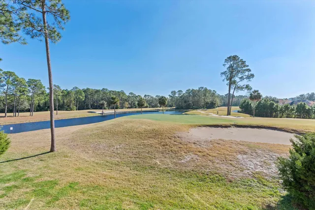a view of a swimming pool and a yard