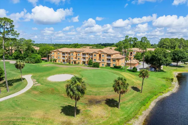 a view of a garden with a house