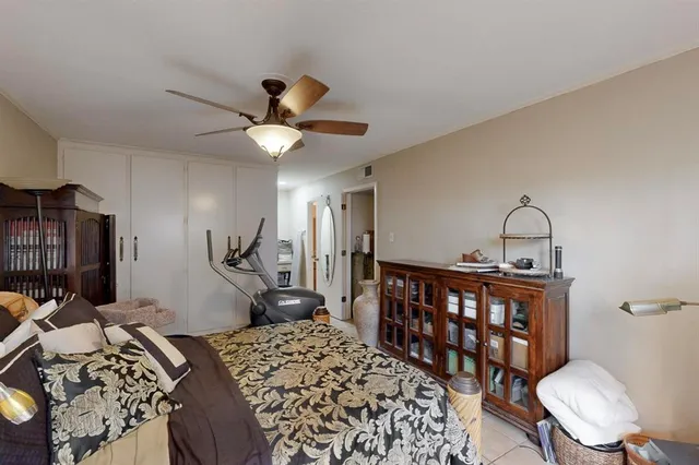 a bedroom with furniture and a chandelier