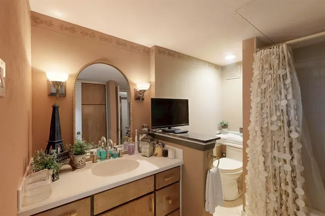 a bedroom with furniture and a window